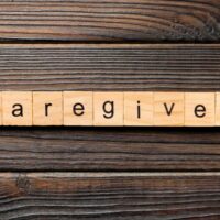 bigstock-Caregiver-Word-Written-On-Wood-358460504.jpg