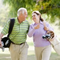 bigstock-Couple-Enjoying-A-Game-Of-Golf-5637433.jpg