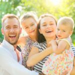 bigstock-Happy-joyful-young-family-with-318942526.jpg