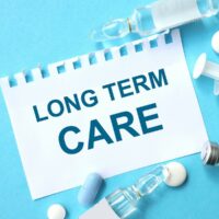 bigstock-Long-term-Care-Text-On-A-Blue-387045070-1.jpg