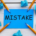 bigstock-Mistake-Word-On-Blue-Paper-O-381846401-1.jpg