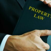 bigstock-Property-Law-In-The-Hands-Of-A-322331236.jpg