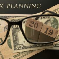 bigstock-Tax-Planning-Concept-Glasses-277536949.jpg